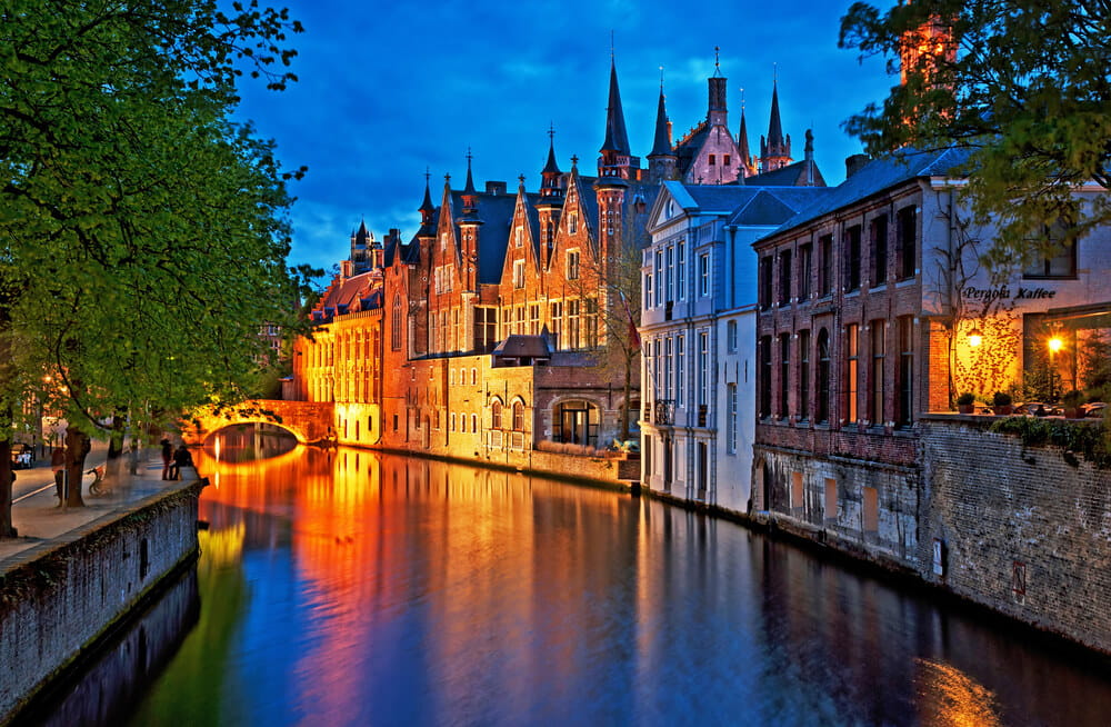 Night Shot of Historic Medieval Buildings along a Canal in Bruges - Belgium