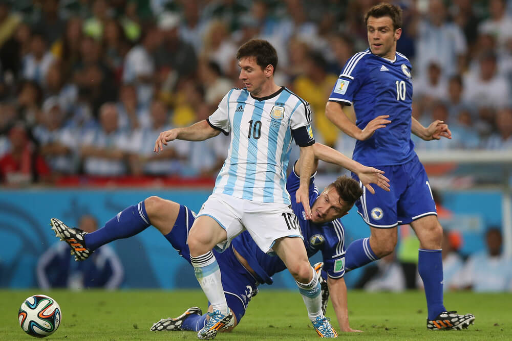 Messi of Argentina and Bicakcic of Bosnia - World Cup 2014