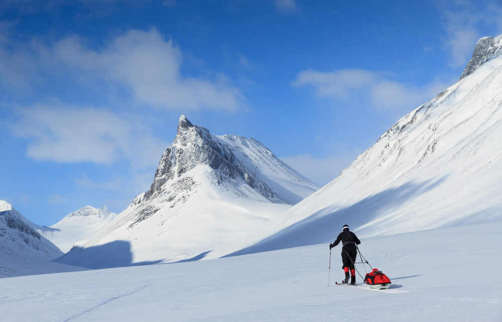Cross Country Skier with Pulka in The Snow near Nallo, Sweden